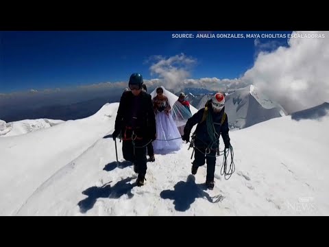 Couple climbs mountain to say 'I do' from summit