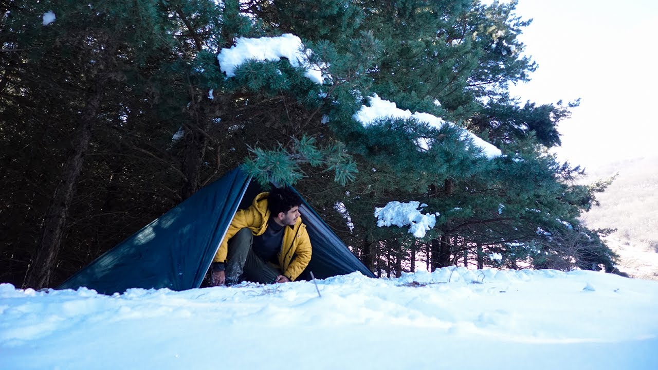 Winter Camping in Deep Snow with Survival Tree Tarp Shelter - YouTube