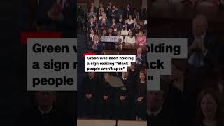 Rep. Al Green escorted out, holding sign in Trump’s SOTU:“Black people aren’t apes”