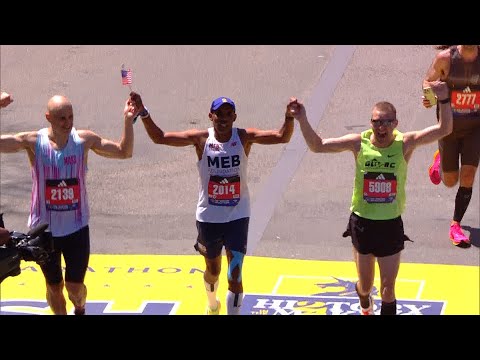 2014 champion Meb Keflezighi crosses the Boston Marathon finish line