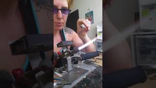 Genea Crivello of Third Eye Gypsy making a twisted cane free lampwork tutorial