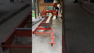 Woodmizer LT15 Classic with SW10 cutting a 5,5 m long spruce for some beams of 10x20 cm.