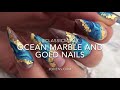 Ocean marble and gold flake gel polish design