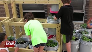 St. Paul Church of Christ in Wapakoneta teaching kids about food with garden bucket project while a