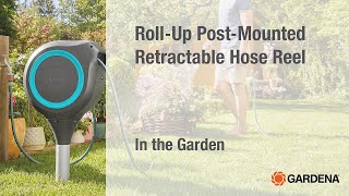Roll-Up Post-Mounted Retractable Hose Reel In The Garden