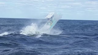 SMALL BOAT GETS BIG AIR AT JUPITER INLET!!!