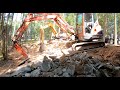 Hammering a hole for a shipping container pool