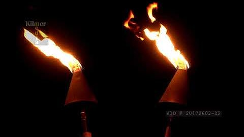 Two Modern Tiki Torches Burning at Night in Hawaii