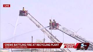 Firefighters attack flames inside OKC recycling plant from above