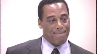 Celebrity O.J. SIMPSON pal A.C. COWLINGS sells his collectible phone cards beside white Bronco --1995 Wealth