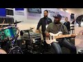 Andrew Gouche NAMM 2019 at ultimate ears booth jamming