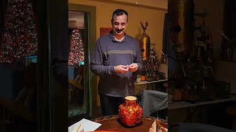 Glenn opening his birthday present from friends an...