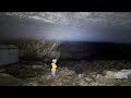 Massive cave with clouds inside