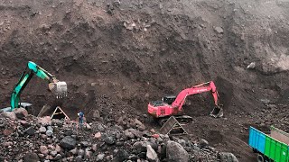 Powerful Excavator at Extreme Sand Mine: Excavator Loading Truck Under High Cliffs. Daily Mining