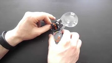 How to attach a magnifier on a thumb compass?