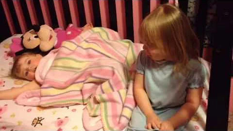 Hailie singing "soft kitty" to her sissy.