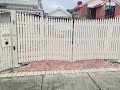 Timber Picket Trackless Bi-fold Automatic Gate - by The Motorised Gate Company