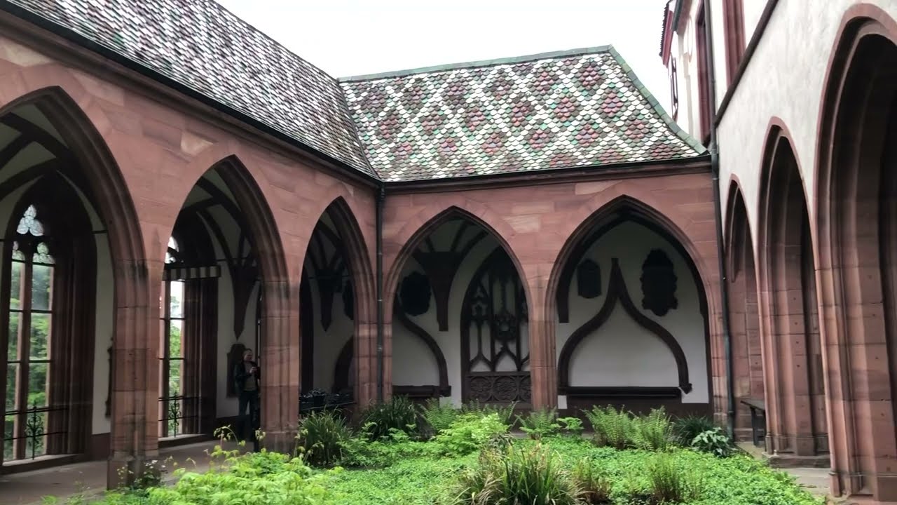 Monks singing in cloister of Basel Munster cathedral