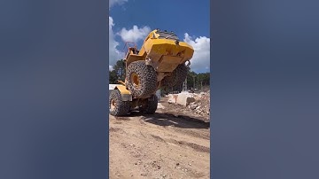 Giant natural granite blocks are mined and loaded - Good tools and machinery make work easy