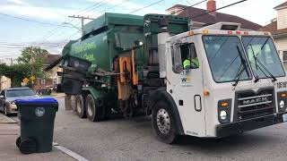 A Waste Management Garbage Truck Banging Trash.