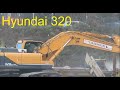 Excavator Hyundai 320 load  mobile crusher demolition site