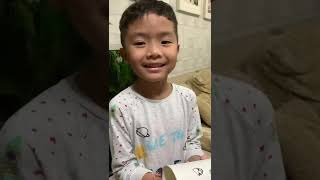 Isidore makes a telephone with cups