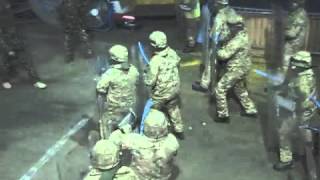 Troops tackle rioters to prepare for mission