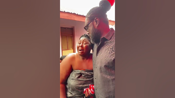 Roman Father Consoles Akua Donkor's Daughter as She Weeps Uncontrollably at Her Mother's Funeral