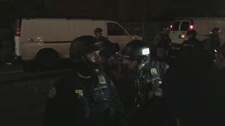 Police and protesters outside the Justice Center
