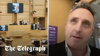 video: Scots Lib Dems leader jeered after dialling in to vote from outside bar