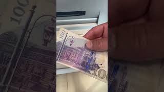 Withdrawing Georgian Gel lari currency bills notes