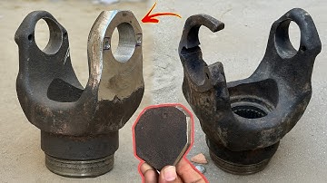 A Tattered Universal Joint Fork Supremely Repaired By Mechanic To Bring Back In Original Condition