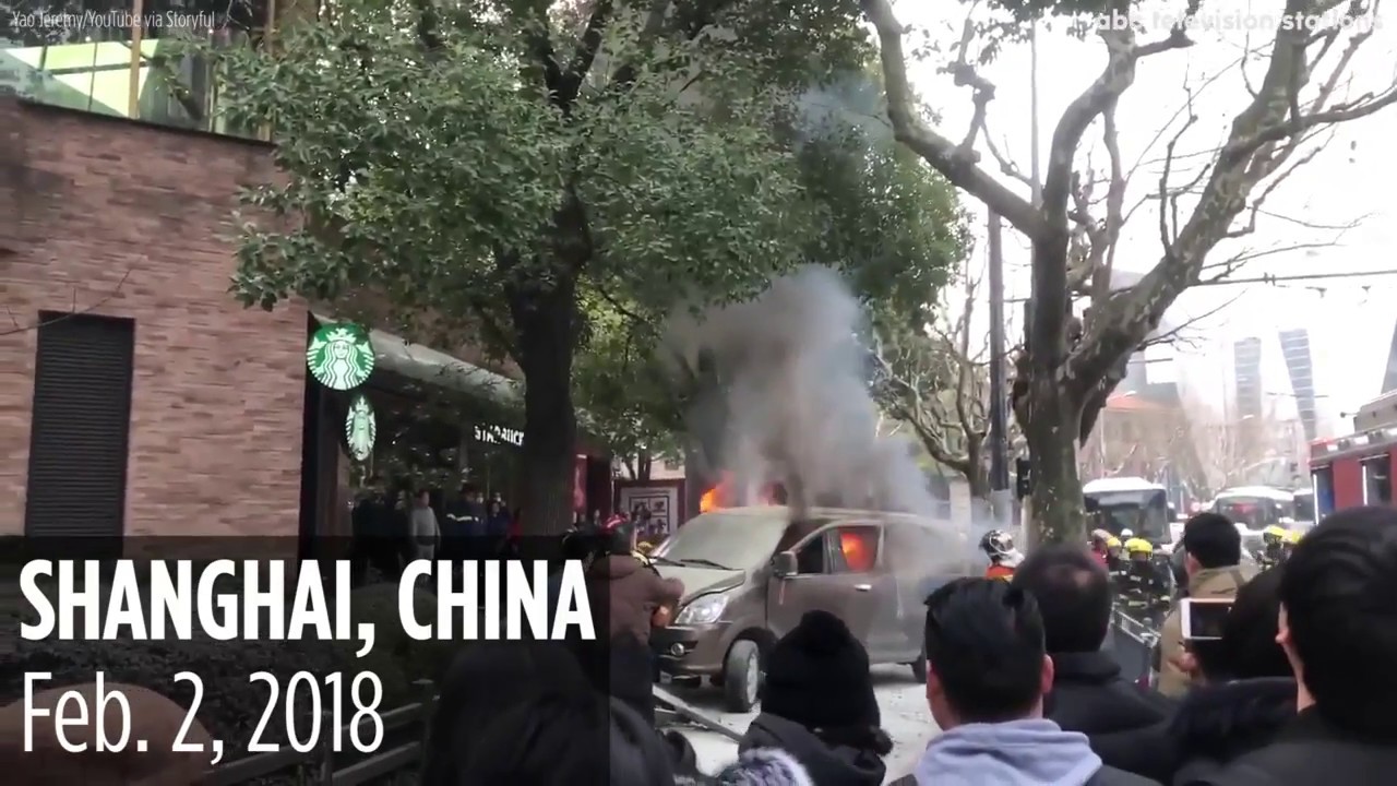 newspaper mockup Car bursts into flames as it jumps curb in Shanghai, injuring several pedestrians
