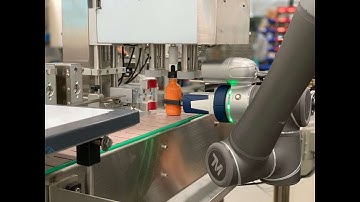 Capping Machine with collaborative robot arm.