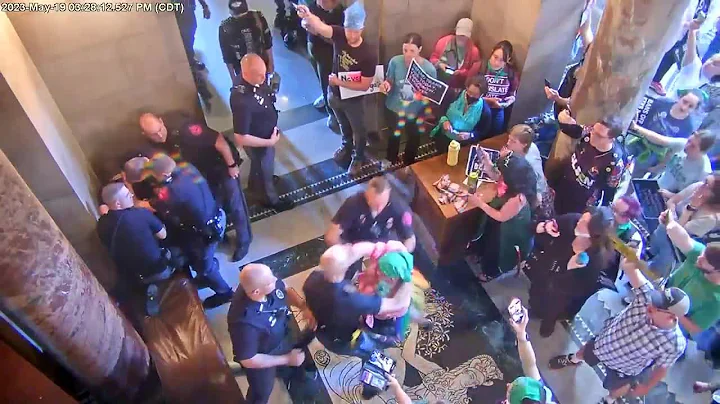 Woman punches trooper during legislative debate at the Nebraska State Capitol