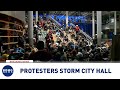 Protesters storm Seattle City Hall