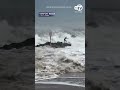 Surfer gets swept over jetty by dangerous SoCal waves