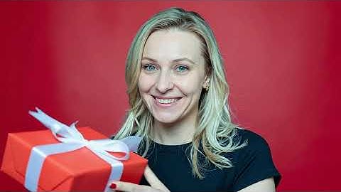 Joyful gift-giving portrait with advanced 3D spatial reconstruction & vibrant studio clarity