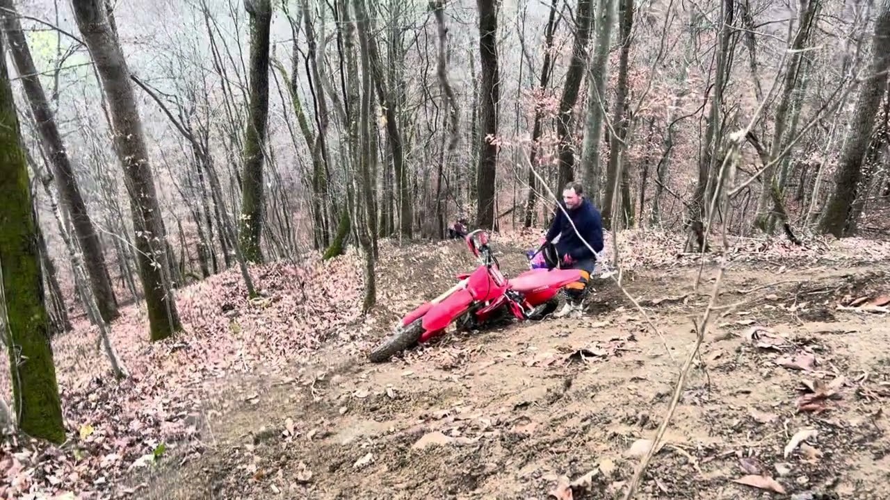 Hill Climbing in little cub creek   Austin on the red Honda topped the hill Braxton on the blue Yz
