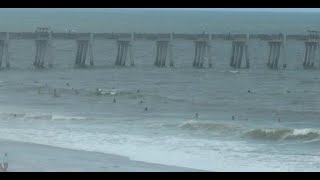 LIVE: Surfers catching waves at Jacksonville Beach Pier ahead of hurricane swell