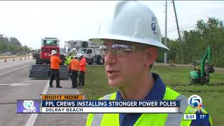 FPL crews installing stronger power poles