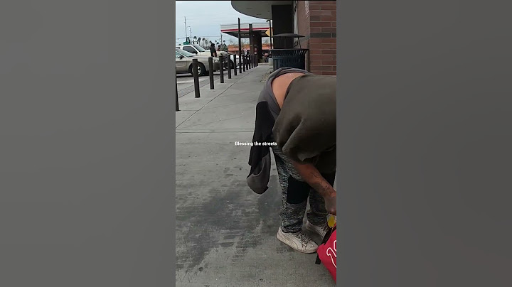 Giving clothes to homeless woman