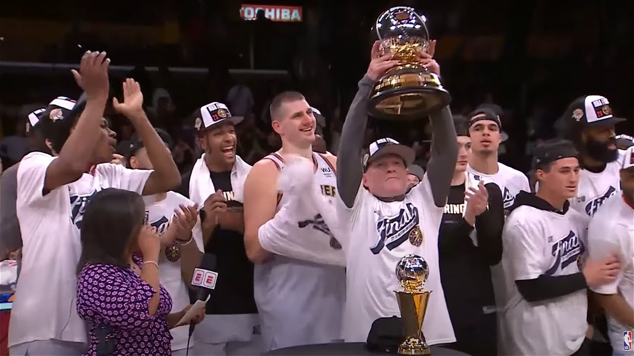 The Denver Nuggets Receive The Oscar Robertson Trophy As The NBA