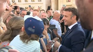 France's Macron walks through Berlin's Brandenburg Gate