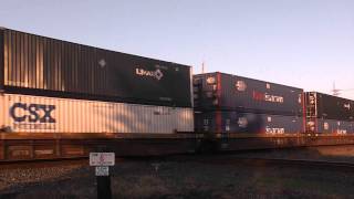 An eastbound  CSX stack train hammers the diamond at Deshler. Oct 8 2011