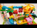 Satisfying Building Blocks Marble Run A course featuring helicopters, fire engines, and elephants