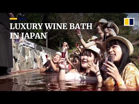 Japanese wine bath event draws crowds despite rising costs