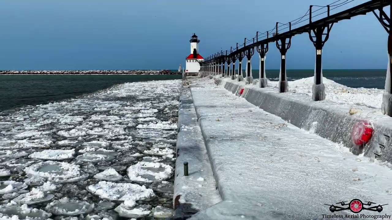 Stunning Ice Building Up Around The Michigan City Lighthouse Pier 6K Drone Footage