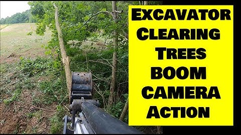 Clearing trees with mini excavator BOOM CAM. Bobcat e42 R series mini excavator
