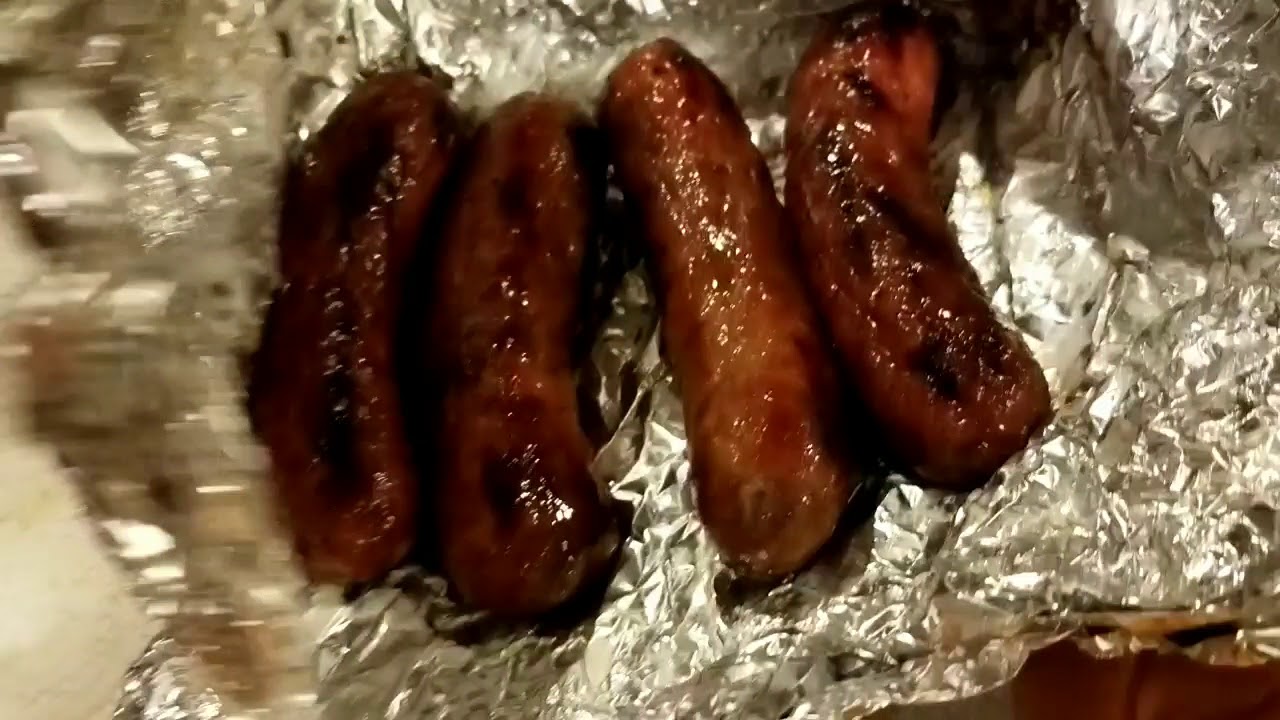 Grilling up Johnsonville Sweet Italian Sausage with sauerkraut YouTube